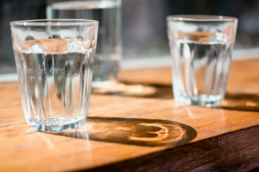 Several glasses of water on a table