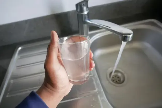 dirty-water-pouring-from-faucet-tap-glass_1013107-2455.webp