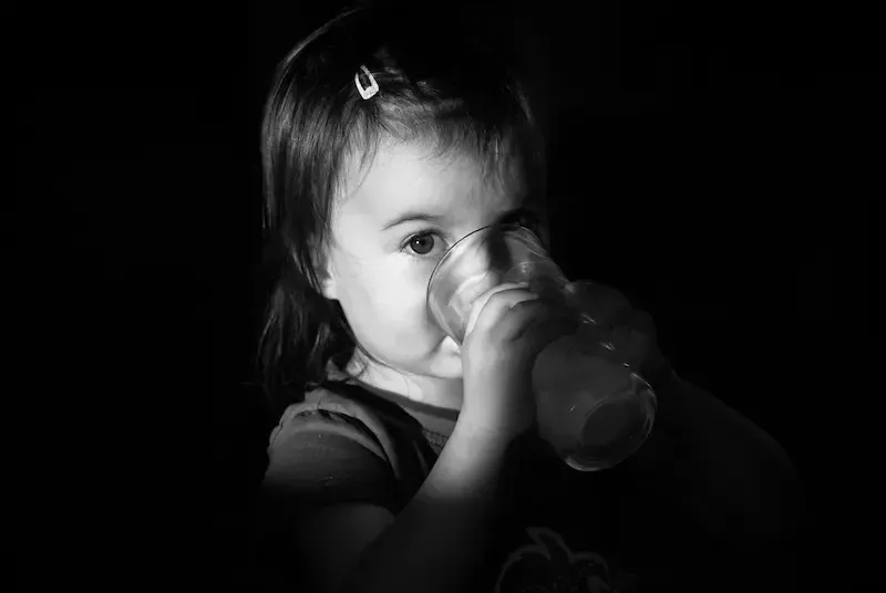 Young girl drinking water