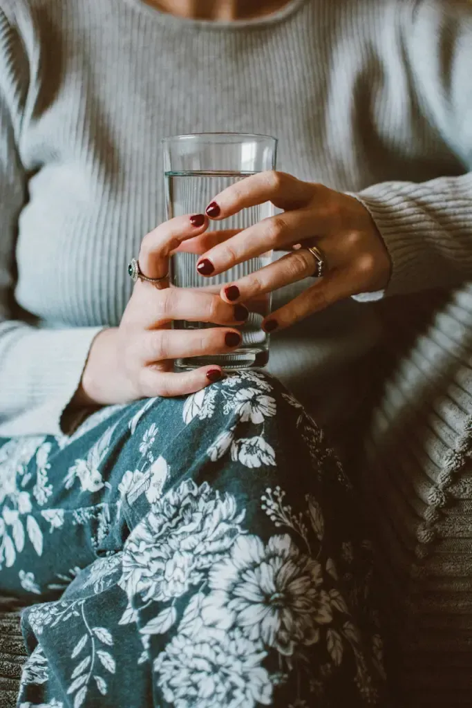 Woman holding a glass of water