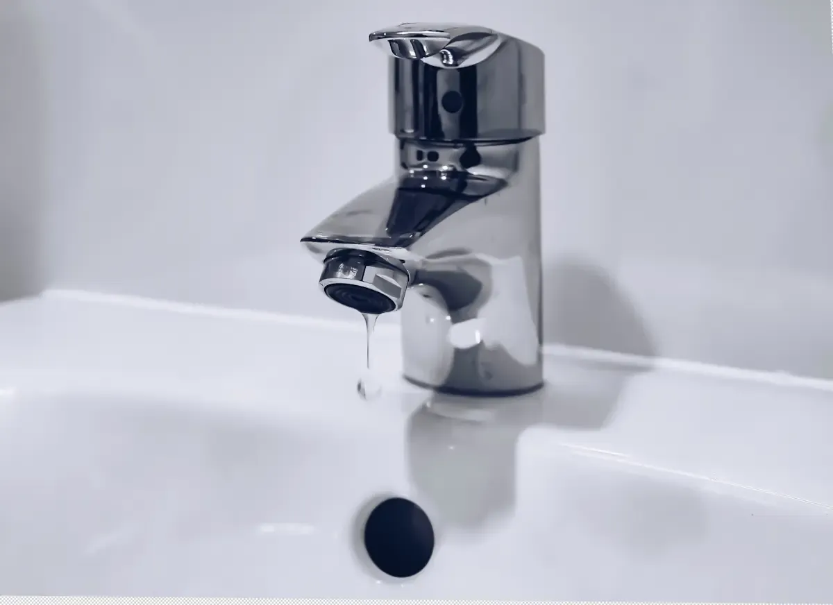 A tap dripping water